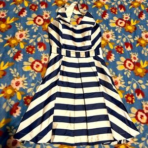 Juniors cream and navy cross back cocktail dress.